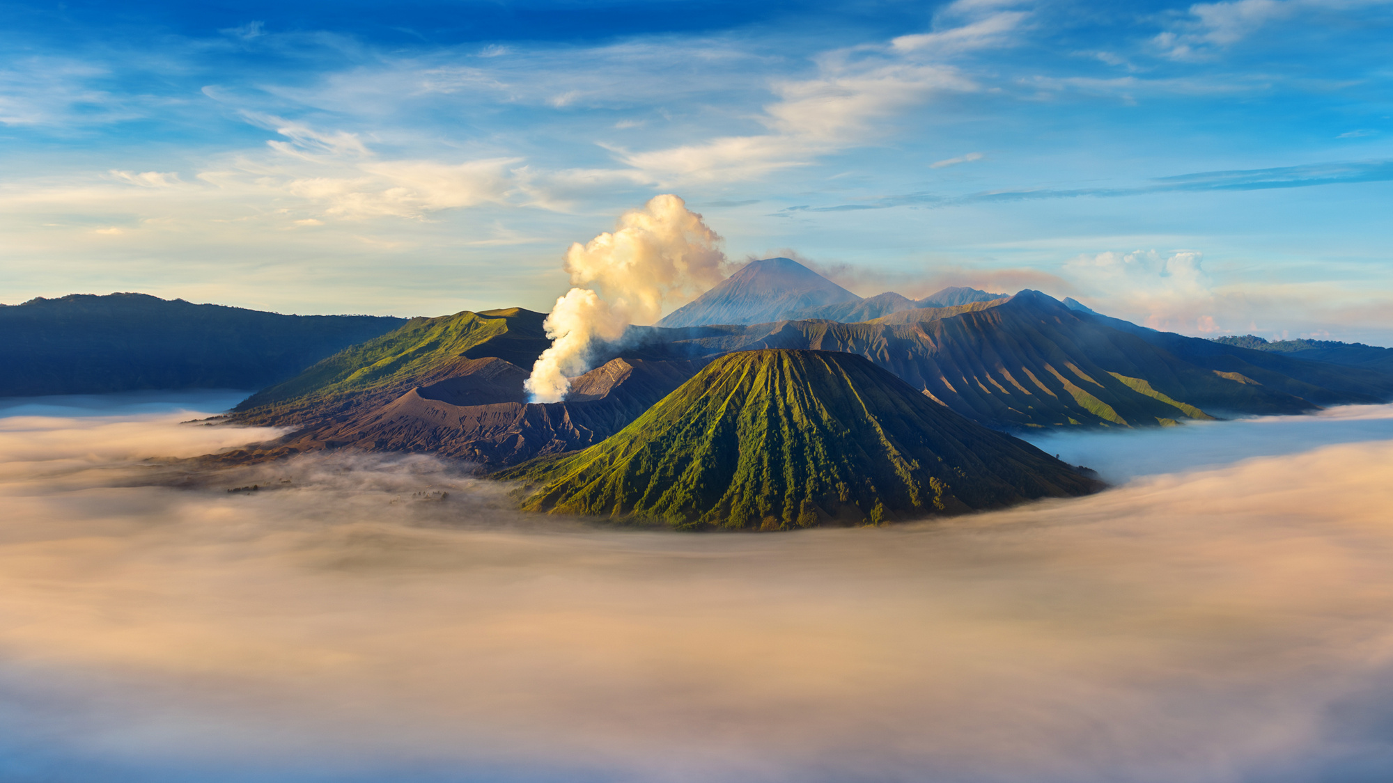 Mount Bromo volcano (Gunung Bromo) during sunrise from viewpoint on Mount Penanjakan in Bromo Tengger Semeru National Park, East Java, Indonesia.